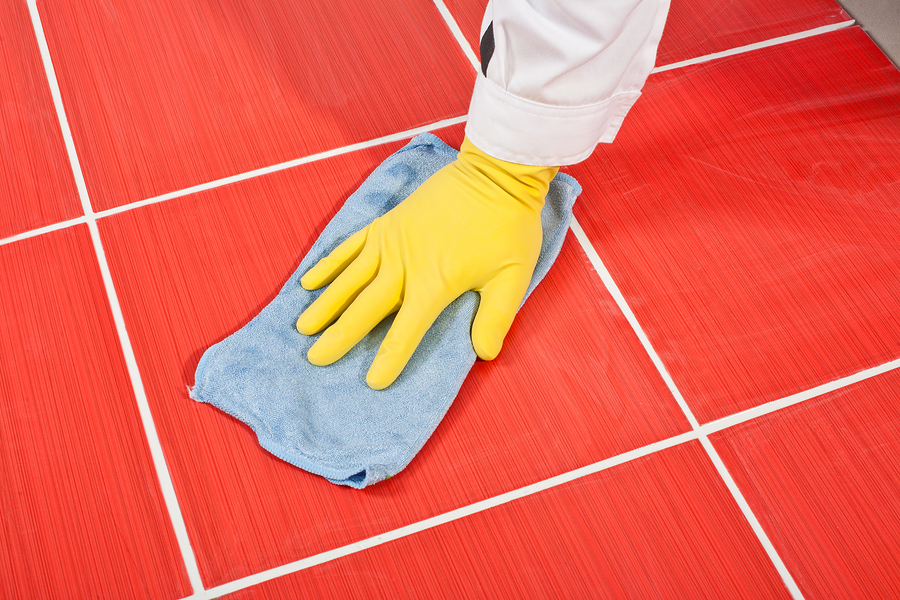 person taking care of newly placed grout mixture