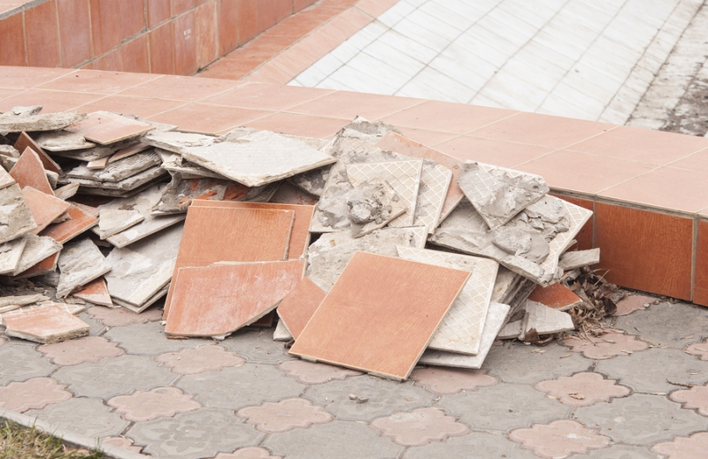 A pile of broken tiles removed from tile flooring demolition